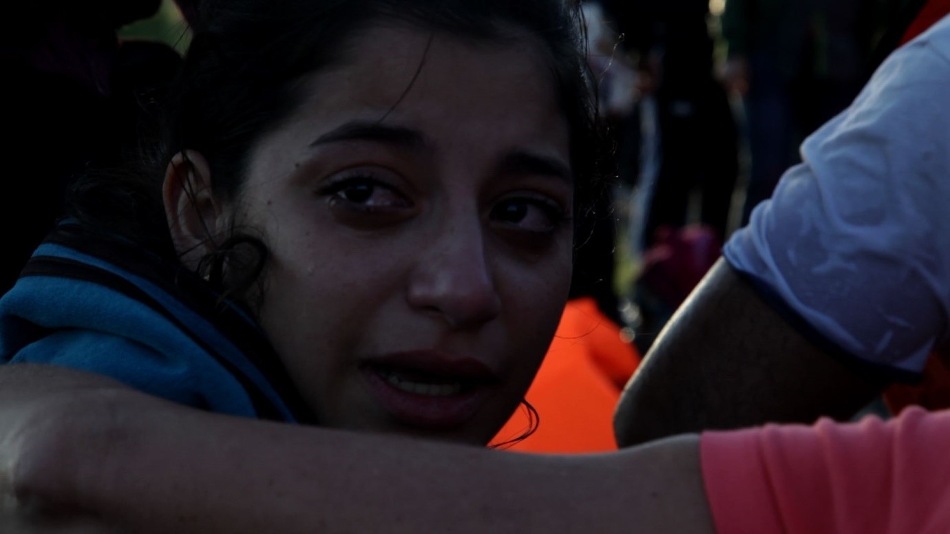 An upset refugee arriving onshore