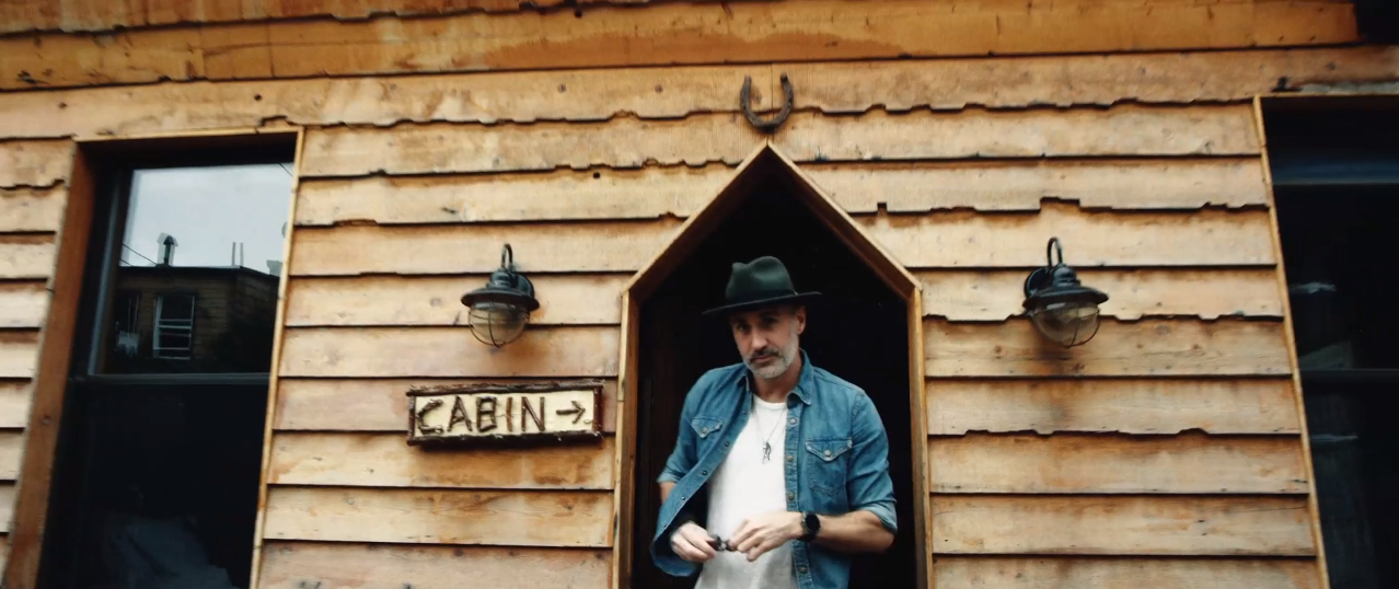 Still from advert depicting a cowboy themed house